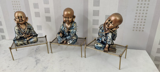 Polyresin Baby Monk Idol On Cot Table Decor 9*13